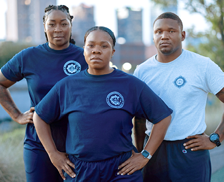 Three Birmingham Police Officers looking at the camera with their hands on their hips